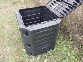 Plastic tank for the production and storage of compost in the garden photo
