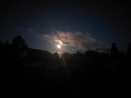 Night full moon in the village photo