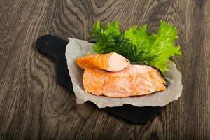 Steamed salmon on wood photo