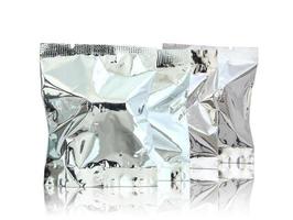 Foil package on reflect floor and white background photo