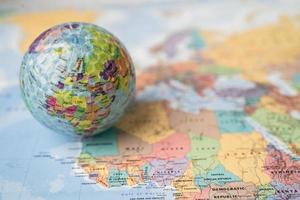 Bangkok, Thailand, May 1, 2021 Africa map at golf ball with flag on world globe map. photo
