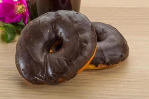 Chocolate donuts on wood photo