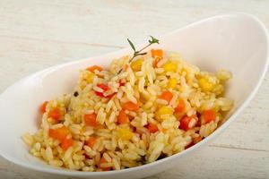 Mexican rice in a bowl on wooden background photo