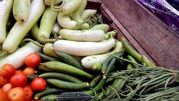 Selling fresh and green vegetables at Local market photo