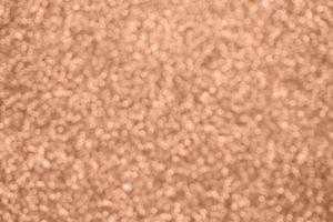 Abstract blur rose gold glitter sparkle defocused bokeh light background photo