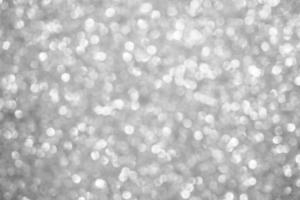 Abstract blur silver glitter sparkle defocused bokeh light background photo