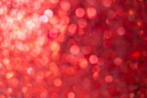 Abstract blur red glitter sparkle defocused bokeh light christmas background photo