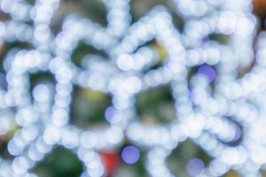 Abstract christmas holiday with festive gold bokeh light on tree blurred background photo