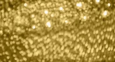 Abstract gold bokeh light festive defocused blur background photo