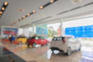 new cars in showroom blurred defocused background photo