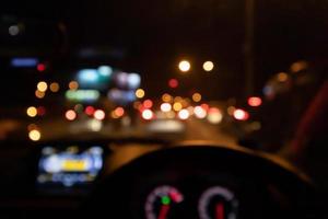 Abstract night traffic blur background with bokeh light photo