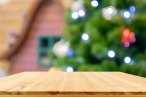 Empty wood table top with Abstract blur Christmas tree with decoration bokeh light background for product display photo