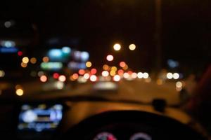 Abstract night traffic blur background with bokeh light photo