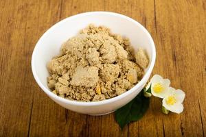 Halva in a bowl on wooden background photo