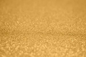 Abstract gold glitter sparkle background photo