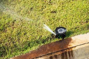 Automatic lawn sprinkler watering grass garden irrigation system photo