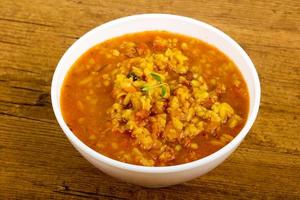 Kharcho soup in a bowl on wooden background photo