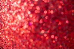 Abstract blur red glitter sparkle defocused bokeh light christmas background photo