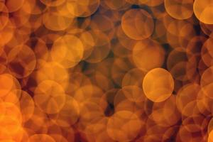 Abstract blur golden bokeh light Christmas holiday background photo