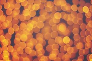 Abstract blur golden bokeh light Christmas holiday background photo