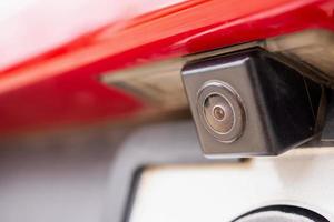 Red car rear view camera close up for parking assistance photo