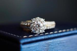 wedding gold diamond ring on jewelry box photo