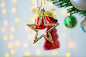 Christmas tree decorated with baubles on pine branches background photo