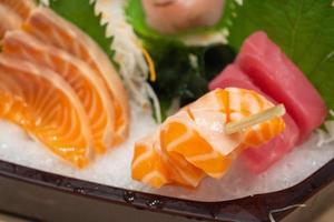 Raw salmon sashimi slice on ice Japanese food photo