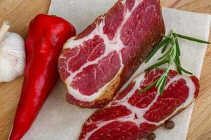 Chuck steak on wooden board close up view photo