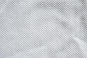 White fabric sport clothing jersey texture background photo