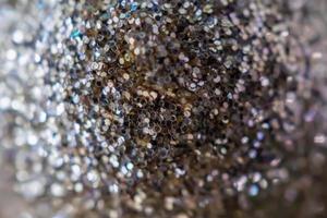 Abstract blur silver glitter sparkle defocused bokeh light background photo