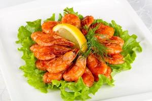 Shrimp cocktail on the plate and white background photo