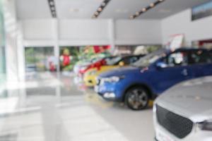 new cars in showroom blurred defocused background photo