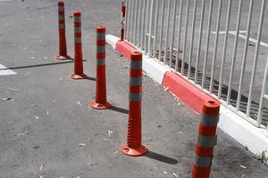 Road barriers along the sidewalk for the safe passage of pedestrians. photo