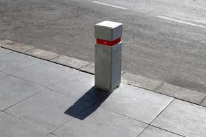 Road barriers along the sidewalk for the safe passage of pedestrians. photo