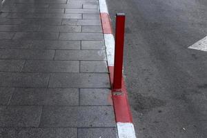 Road barriers along the sidewalk for the safe passage of pedestrians. photo