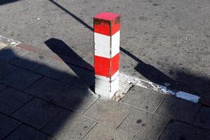 Road barriers along the sidewalk for the safe passage of pedestrians. photo