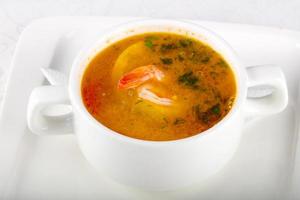 Prawn soup in a bowl on white background photo