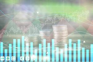 Financial stock market graph and rows of coins concept rows of coins lined up There is a graph showing growth and savings to plan for independent spending photo