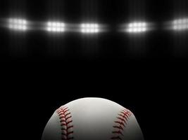 Baseball ball on a black background under stadium lights photo