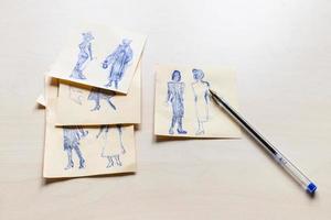 sketches of fashionable silhouette drawn by pen photo