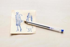 sketch of fashionable silhouette and blue pen photo