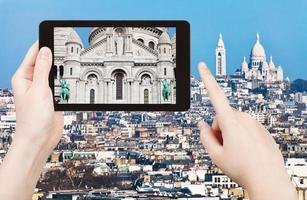 tourist taking photo panorama of montmartre hill