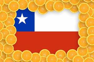 Chile flag  in fresh citrus fruit slices frame photo