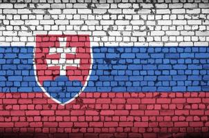 Slovakia flag is painted onto an old brick wall photo