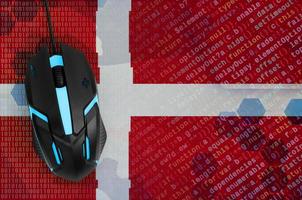 Denmark flag  and computer mouse. Digital threat, illegal actions on the Internet photo