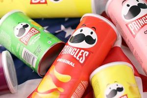 KHARKIV, UKRAINE - DECEMBER 16, 2021 Pringles product with new logo. Pringles is a brand of potato snack chips owned by the Kellogg Company photo