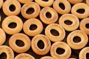 Close-up photo of fresh yellow bagels. A popular kind of flour products. One of the traditional Russian treats for tea