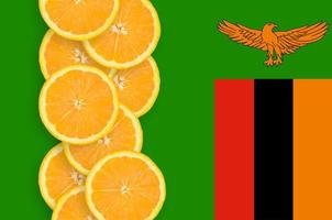 Zambia flag and citrus fruit slices vertical row photo