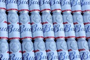 SUMY, UKRAINE - AUGUST 01, 2021 Many Cans of Budweiser Lager Alcohol Beer - Budweiser is a Brand from Anheuser-Busch Inbev photo